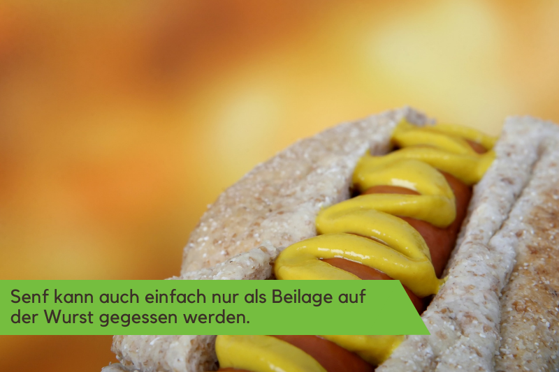 Speisesenf auf einer Wurst